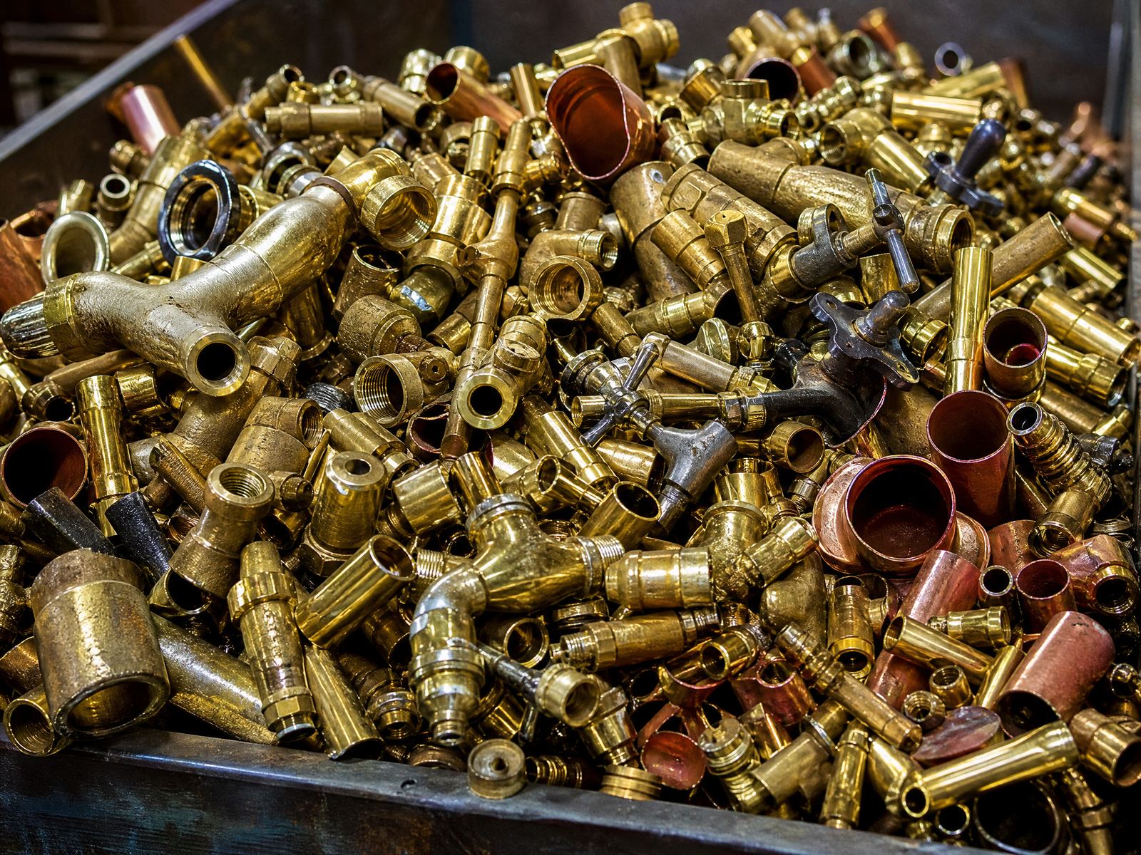 Yellow and red brass fittings and valve scrap bin