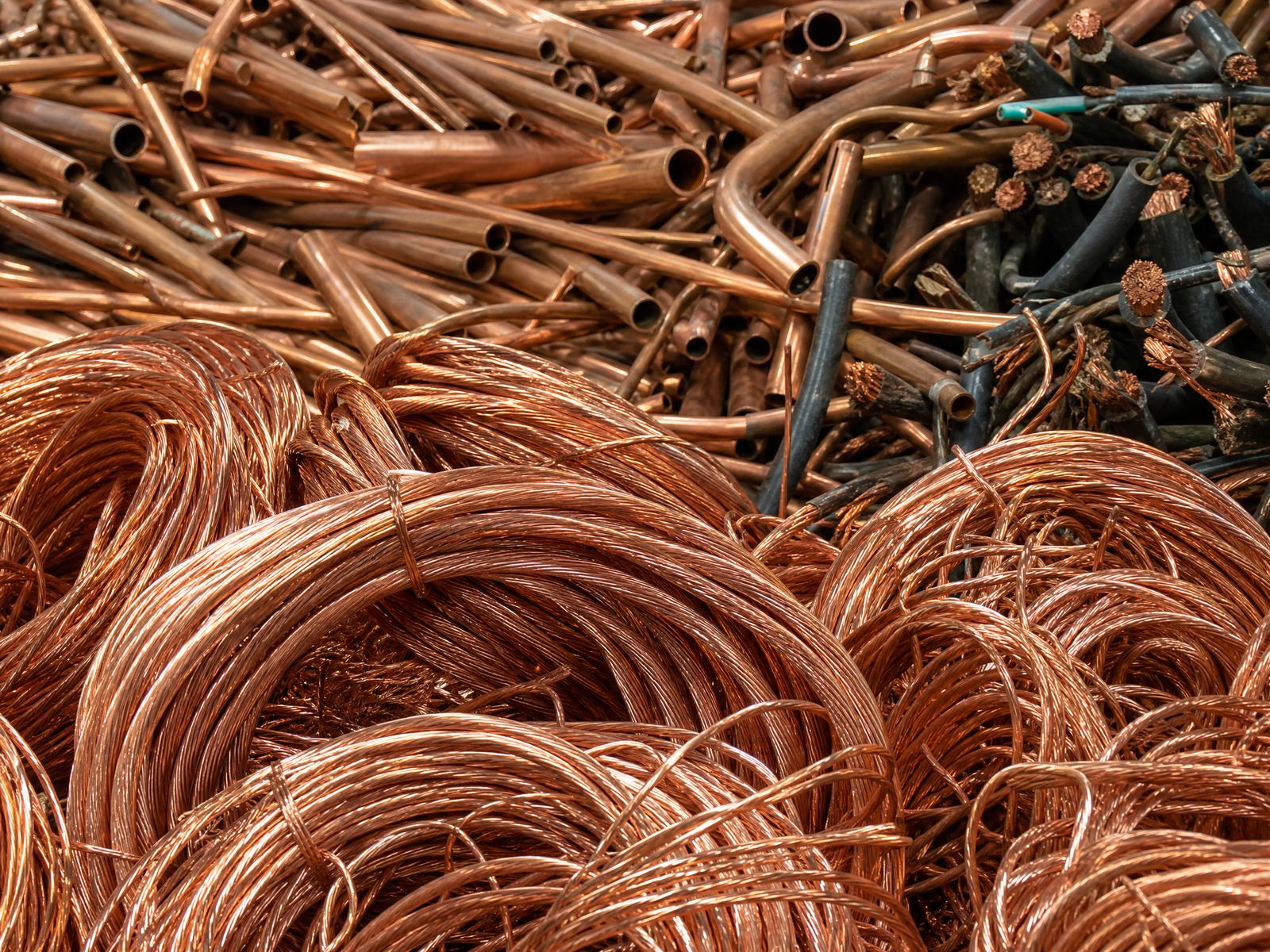 Bare bright copper wire and copper tubing scrap pile