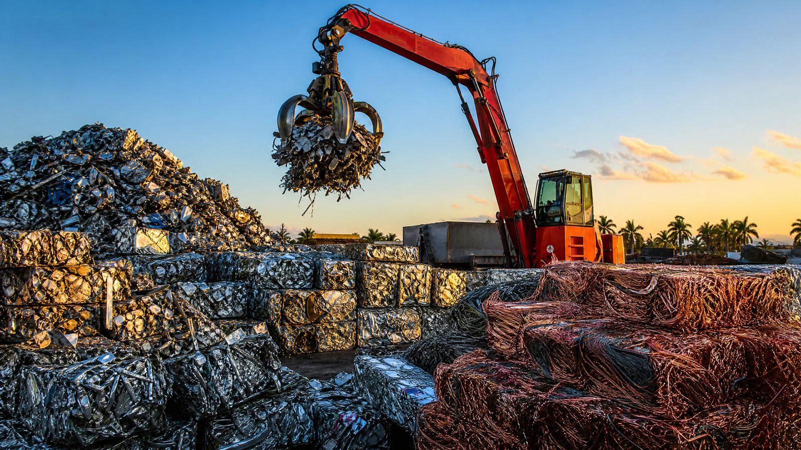 Florida scrap metal recycling yard with crane and sorted metal piles